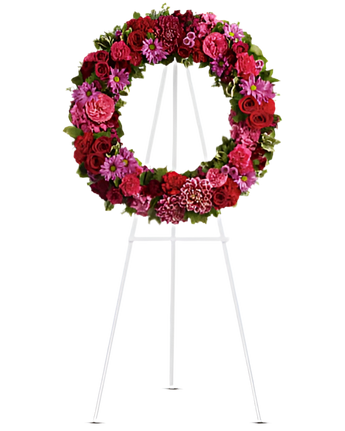 Arreglo funerario Amor Infinito de flores de Doral Roses Miami, con flores blancas y detalles que representan amor y protección.