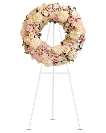 Corona funeraria con flores blancas y verdes de Doral Roses Miami, diseñada para condolencias y reconciliación.