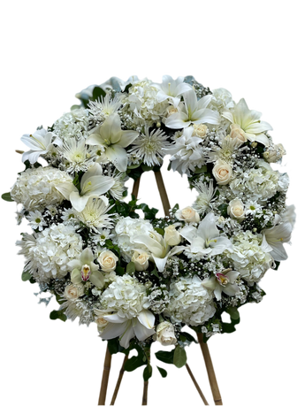 Corona funeraria de flores de Doral Roses Miami, con flores blancas y verdes, símbolo de esperanza y condolencias.