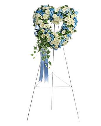 Corona funeraria corazón puro de flores de Doral Roses Miami, con flores blancas y detalles para condolencias y paz.